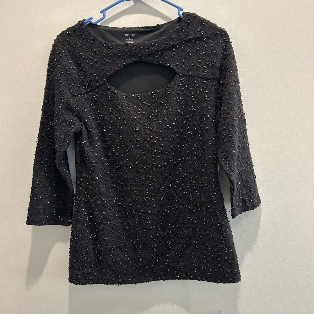 Jennifer Lopez Black Textured Blouse — lined inside for comfort.